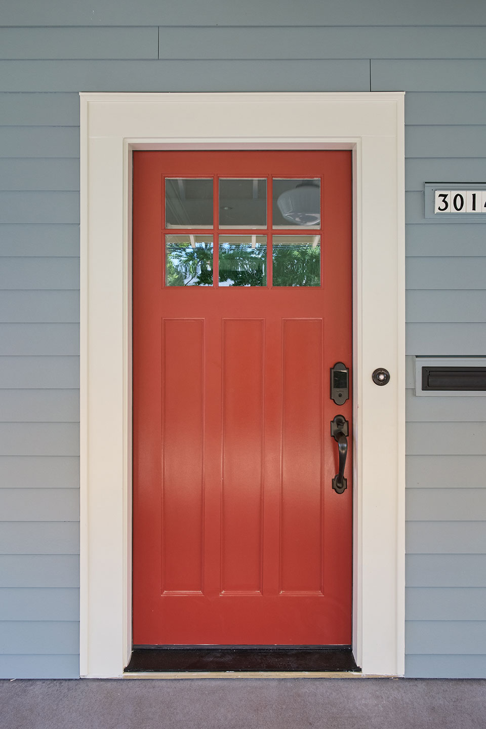 The front door of the Alameda Craftsman is painted a bright red.