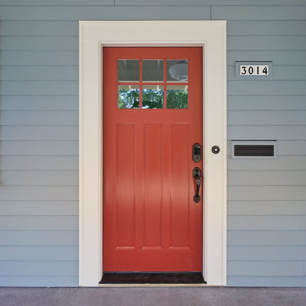 Red front door craftsman house.