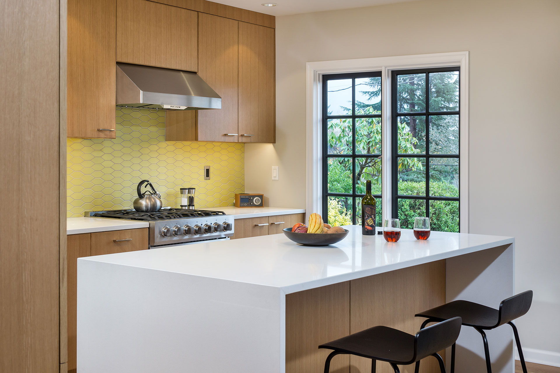 At the Alameda Modern, the kitchen island features quartz countertops with a waterfall edge.