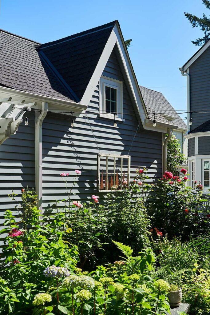 The side of the new garage design features steeply pitched gables.