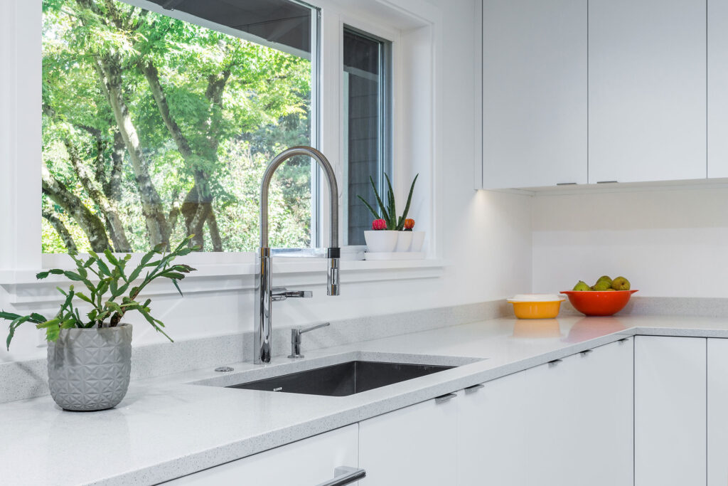 White RTF cabinets and white quartz countertops in the residential remodel.