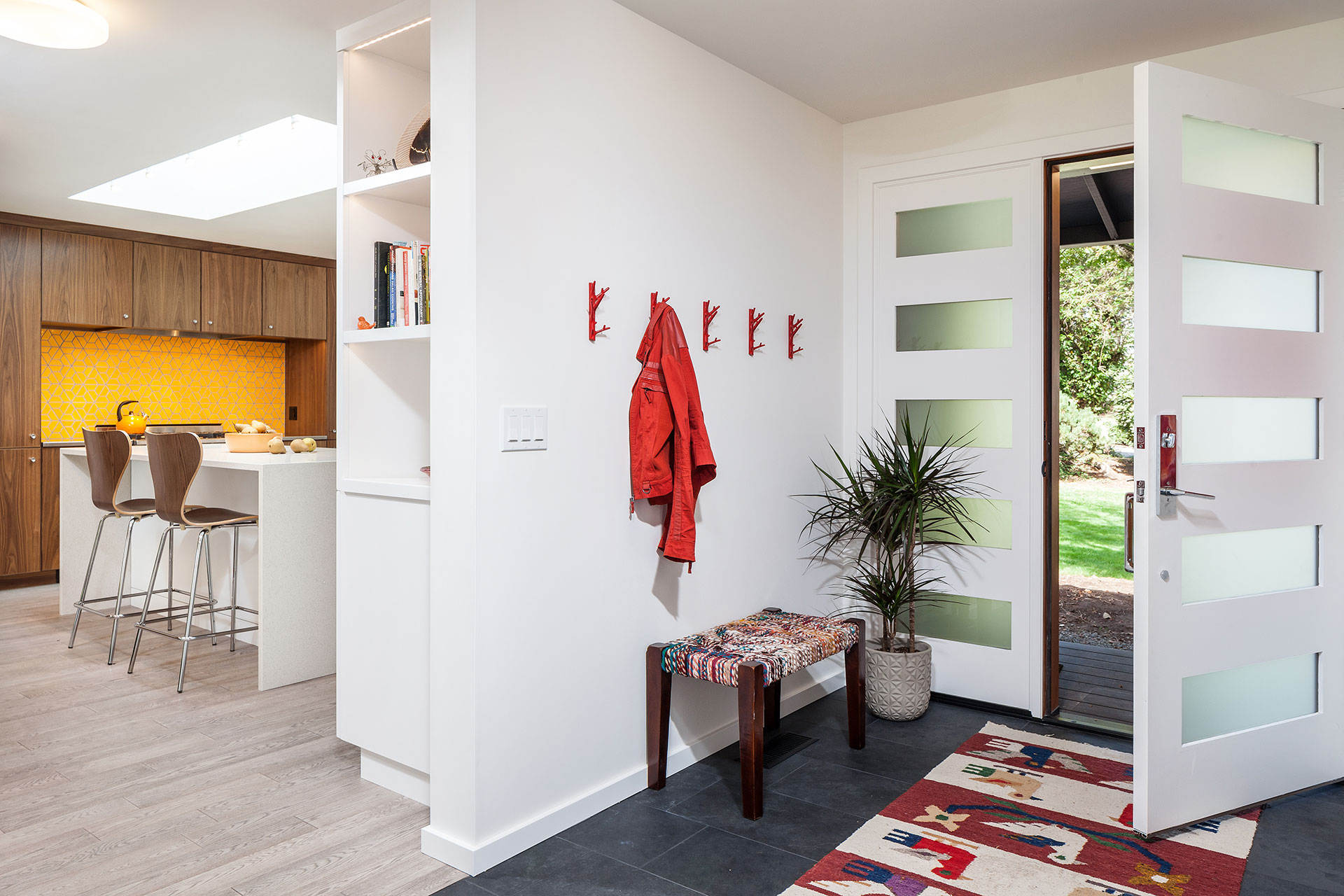 Entry hall after the residential remodel. It is more open to the kitchen and living room.