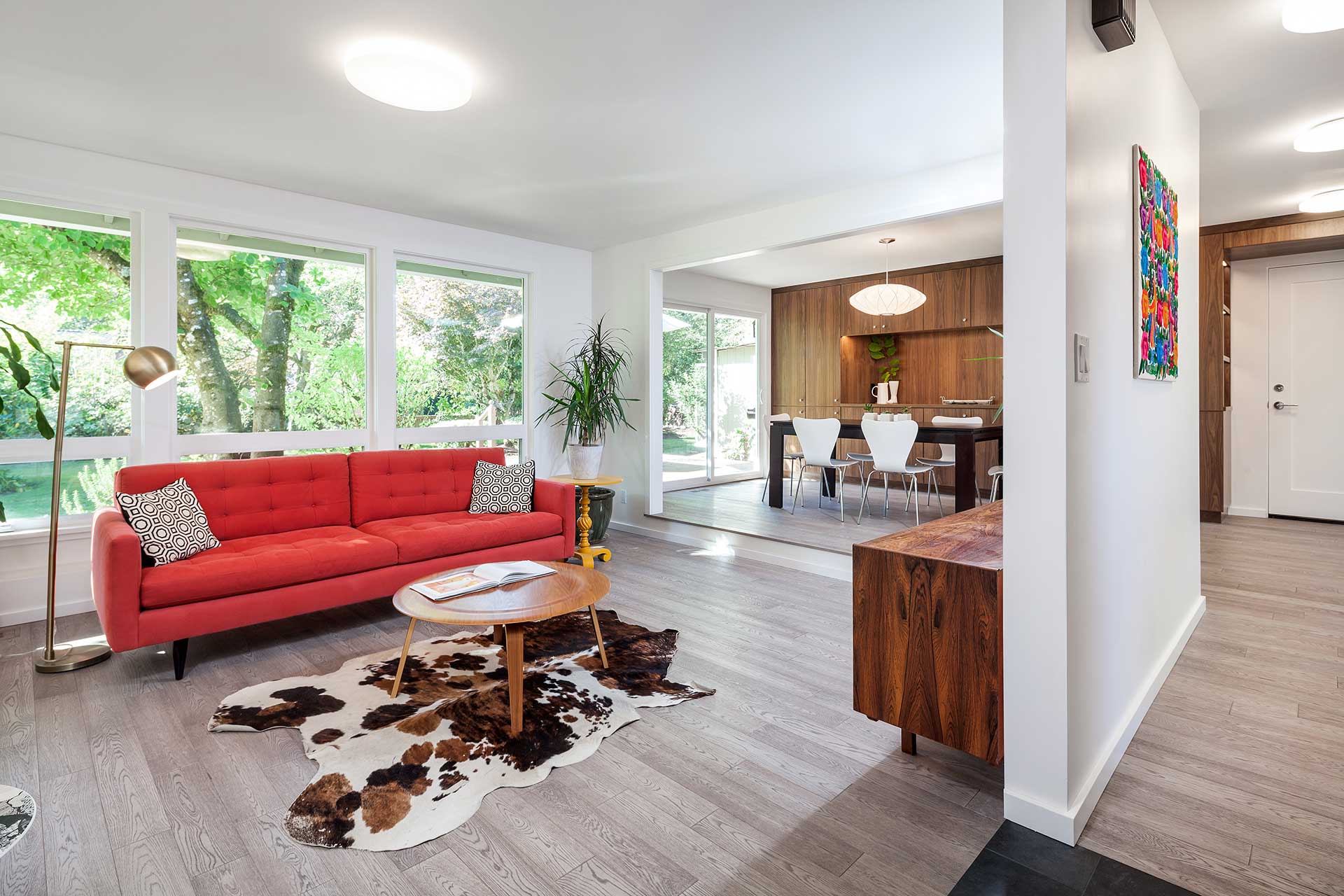 Open plan after the residential remodel. The four spaces (living, dining, entry and kitchen) are open to each other and have a much more flowing layout.