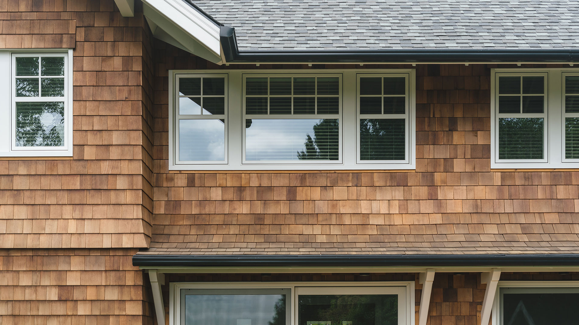 After the whole house remodel, large windows and sliding glass doors at the back of the house provide a view of Mount Hood.