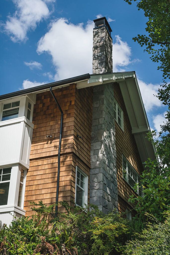 A new chimney made of cut basalt stone was part of the whole house remodel.