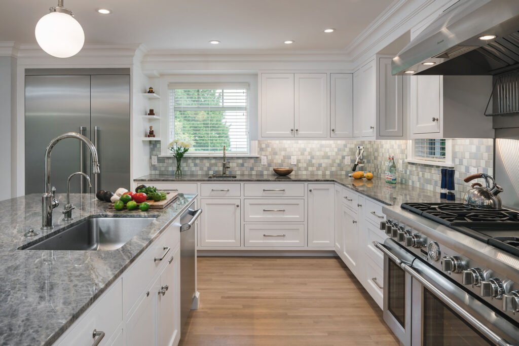 A kitchen with custom Craftsman flush inset cabinetry was part of the down to the studs remodel.