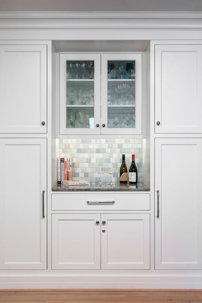 A wet bar with custom Craftsman flush inset cabinetry was part of the down to the studs remodel.