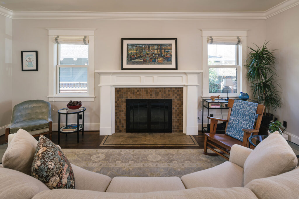 Fireplace with new painted mantle and tile surround in the whole house remodel.