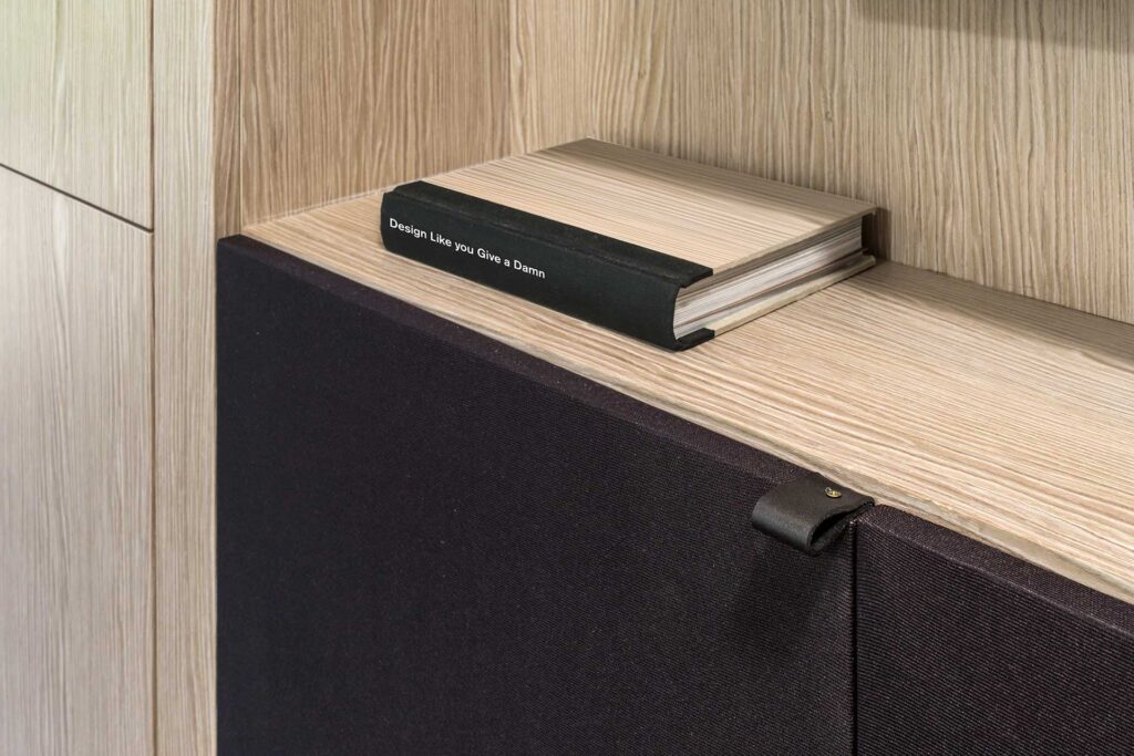 White oak, black fabric, and custom leather pulls form a stereo cabinet at the Patton Modern.