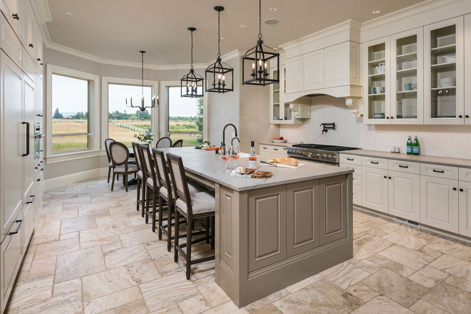 The renovated kitchen at Scout's House features a large island, a gas range with custom hood and two dishwashers.