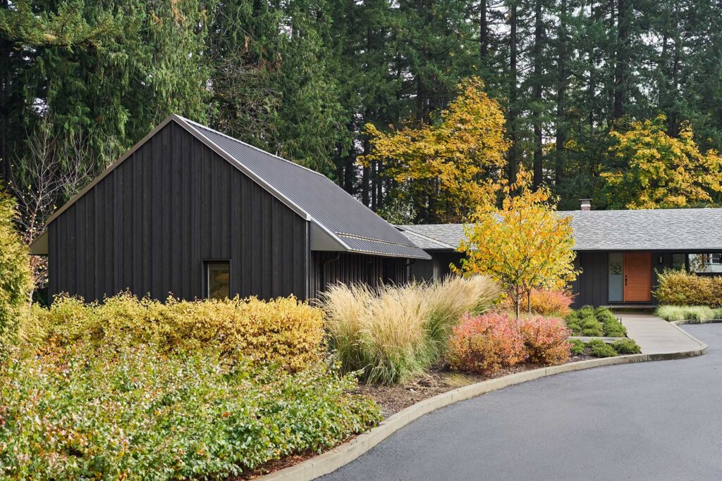 The home office sits in front of the main house and is visible from the street.