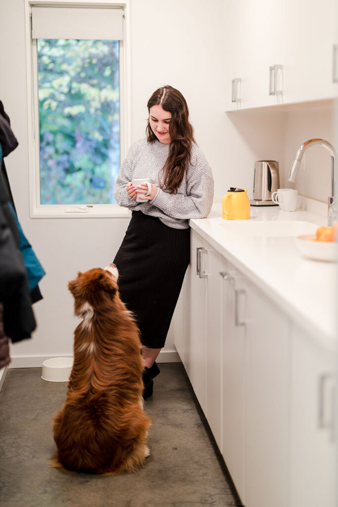 The home office houses a small workroom with storage space and a sink for making coffee or tea.