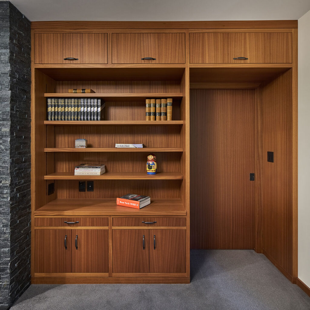 All of the cabinetry, doors, windows and trim are mahogany in the basement renovation.