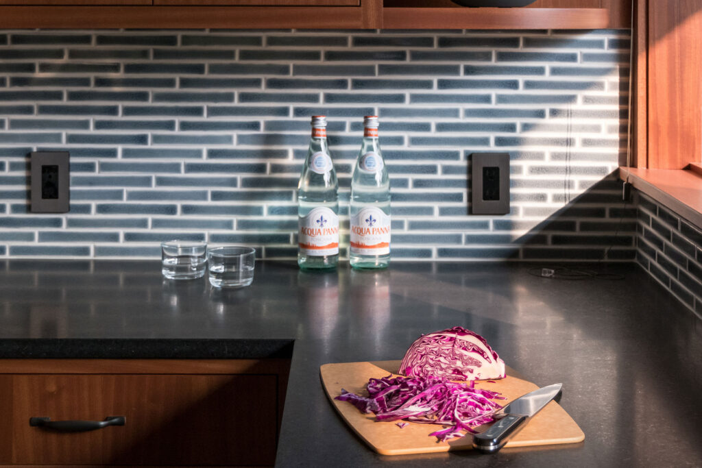 1" x 6" blue tile is set in a running bond pattern for the kitchen backsplash.