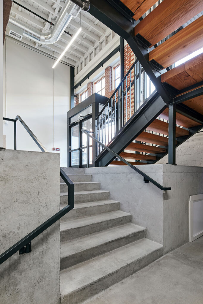 New stairs leading to the basement level of the building.