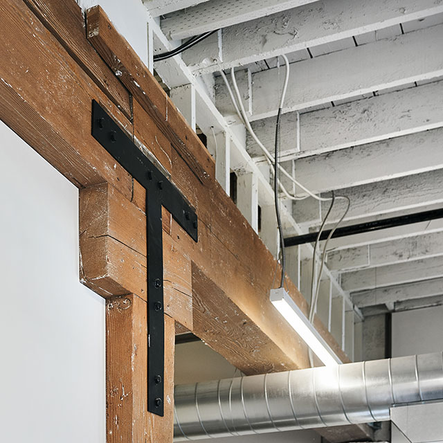 T-shaped plate holding the framing together at the warehouse renovation.