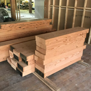 Reclaimed refinished historic fir beams salvaged from the warehouse renovation.