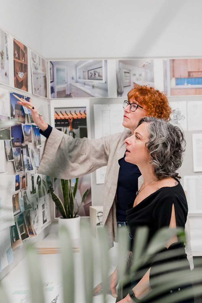 Lisa Christie discusses a project with a client at her Portland architecture office.