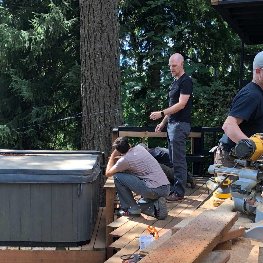 Adam Christie discussing a project on site with the general contractor.