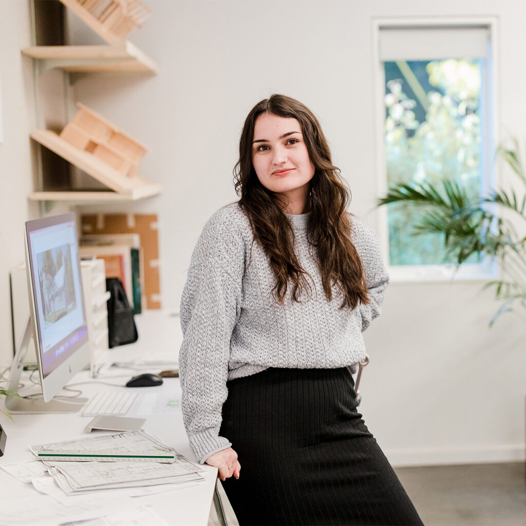 Alexa Esguerra standing in the Portland architecture office.