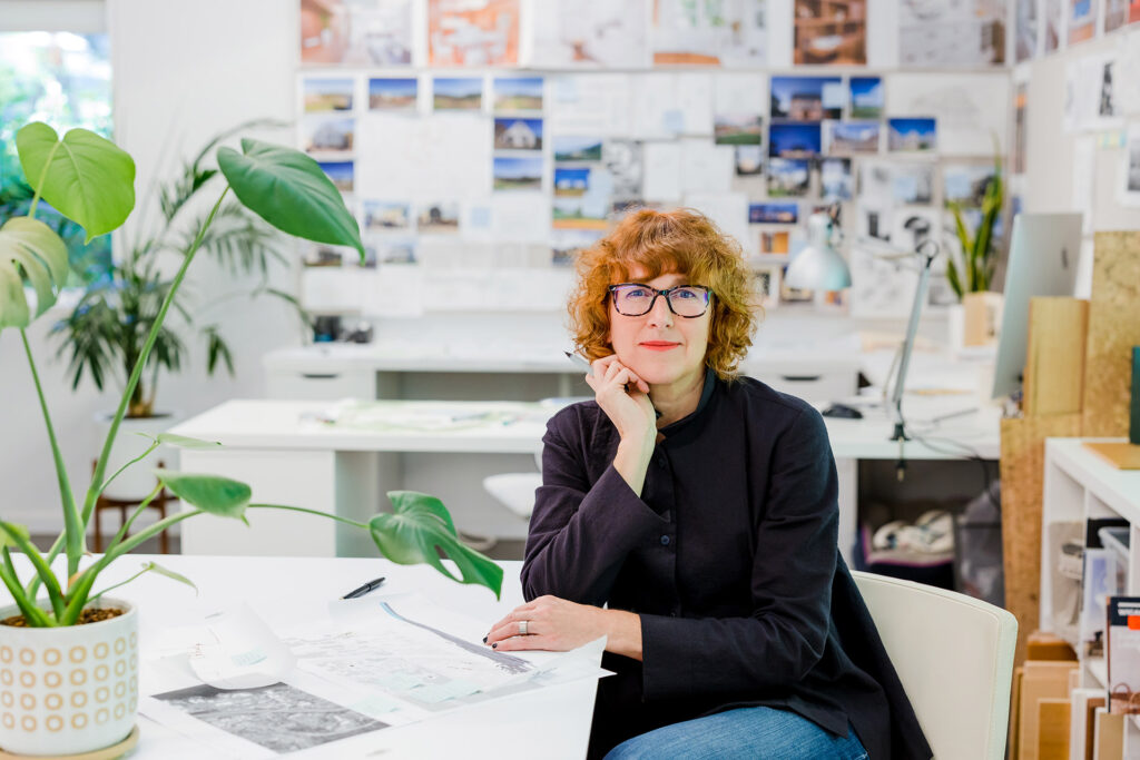 Lisa Christie sitting in the Portland architecture office.