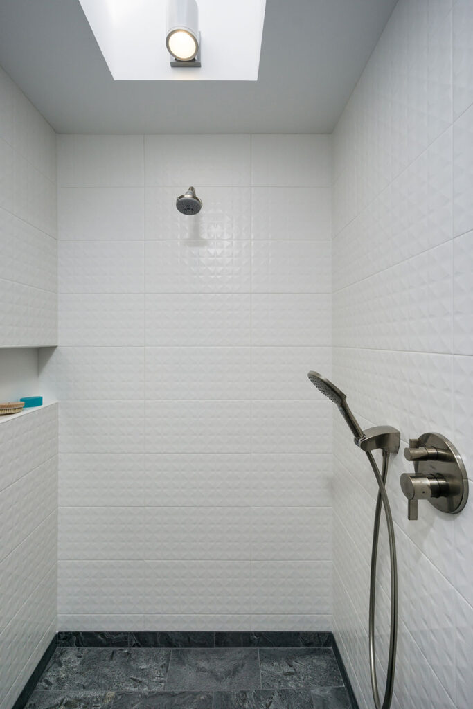 The primary bathroom shower has a large skylight which floods the space with light, even on dark Pacific Northwest days.
