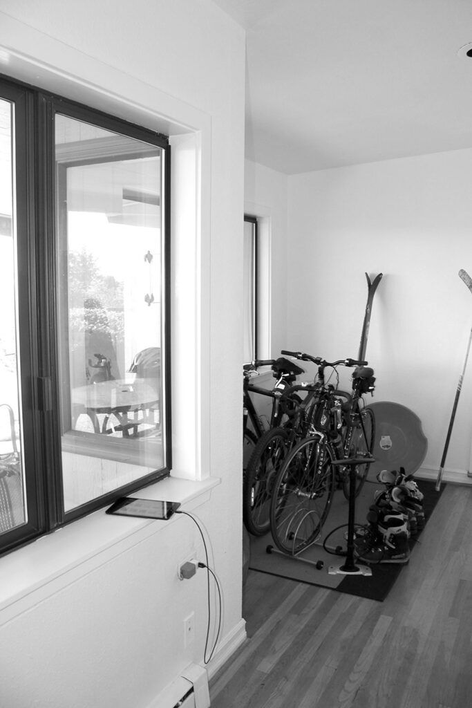 Bikes, skies and snow sleds fill a corner of the existing kitchen.
