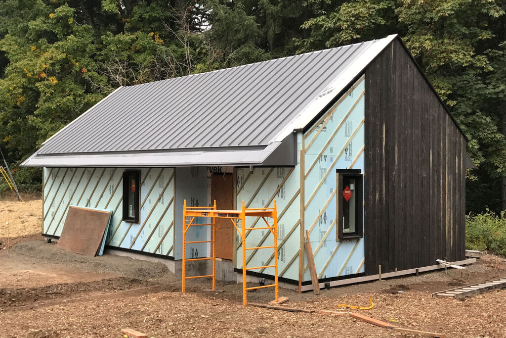 A rain screen being installed on a building.