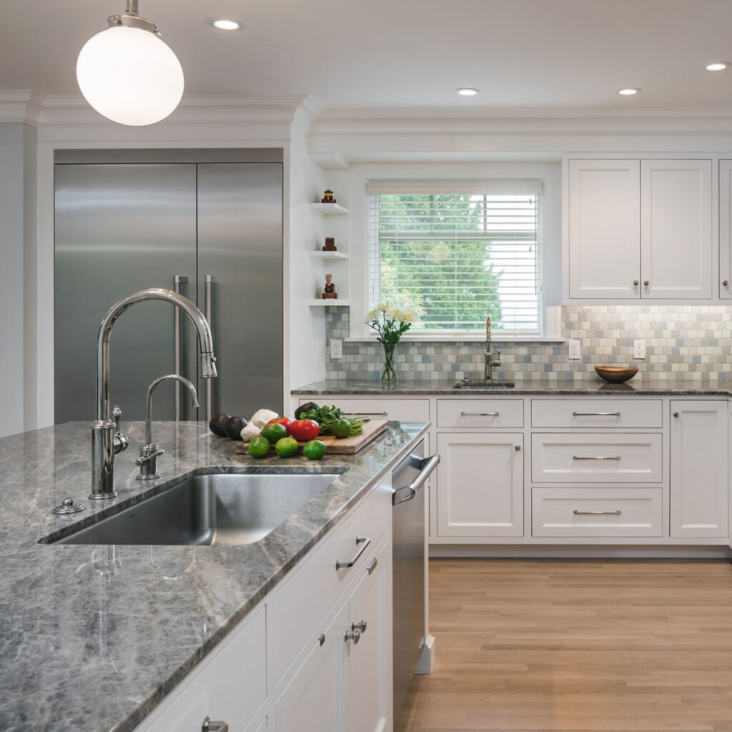 The fridge at the Hillside House is fully integrated with stainless steel doors.