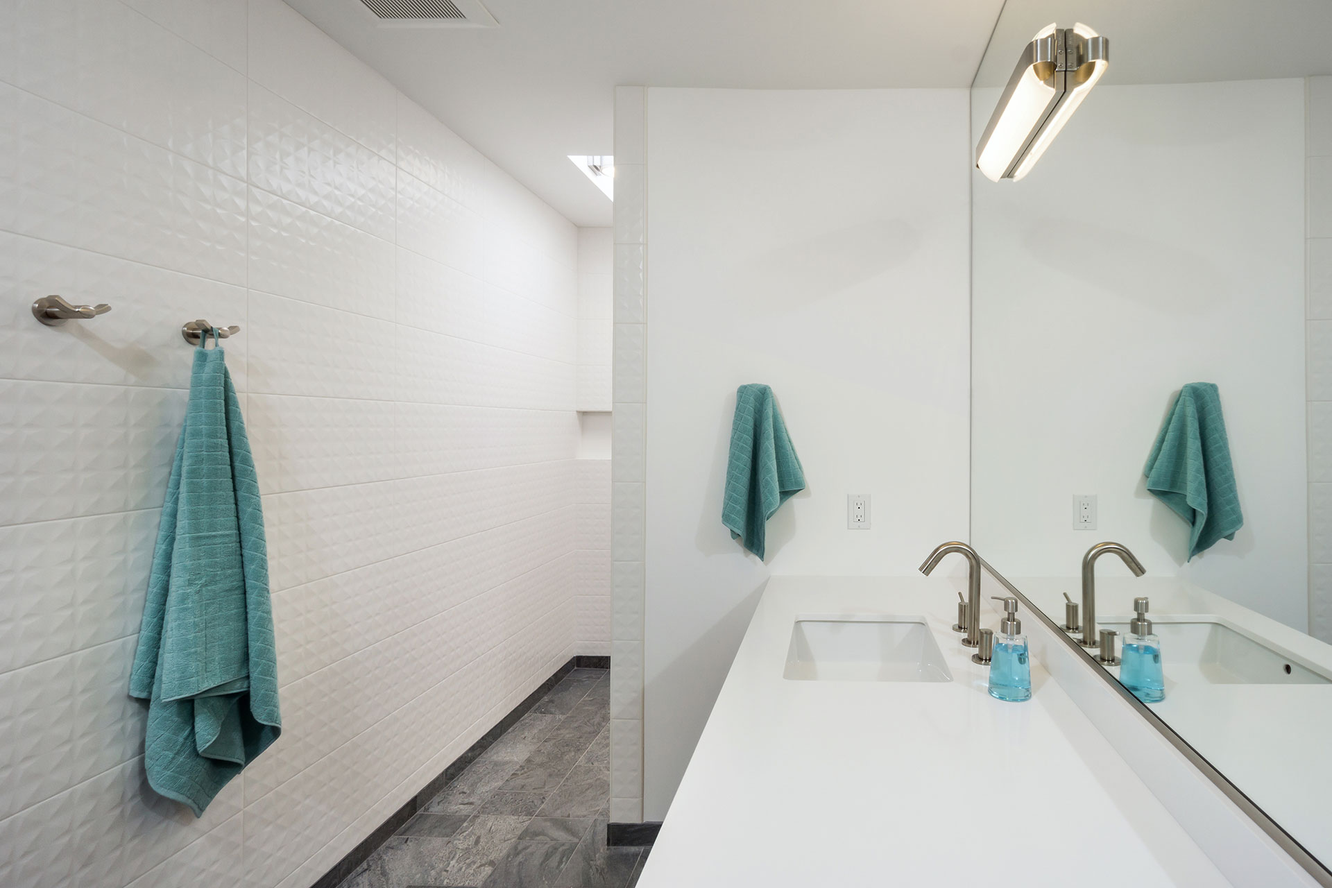 This is a walk-in shower at the Riverview Mid-Century by Christie Architecture.