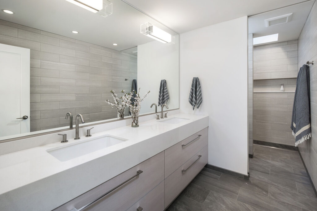 This is a walk-in shower at the Modern Farmhouse by Christie Architecture.