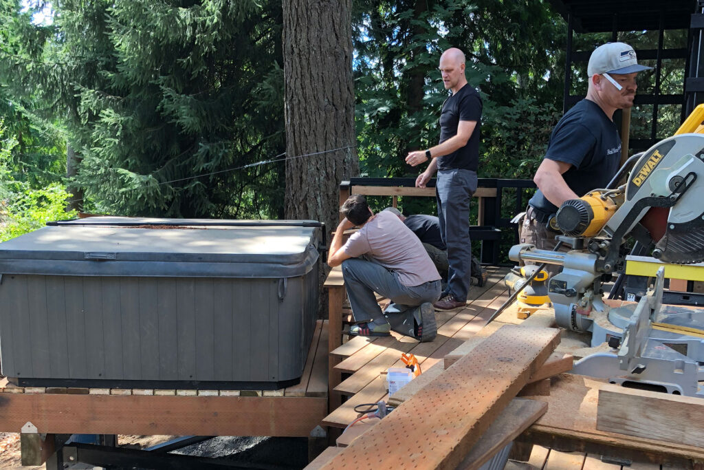 Adam Christie discusses a project on site with the contractor and FIR inspector.