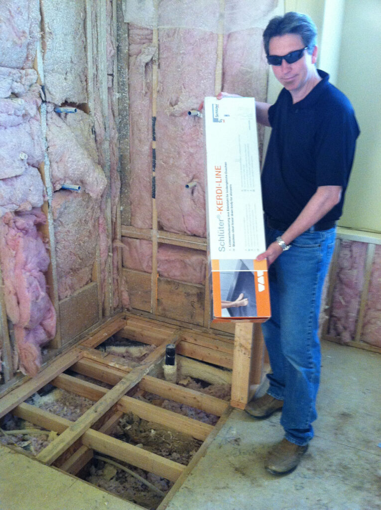 Chris Campbell of Campbell's Tile Concepts, getting ready to install a shower pan.