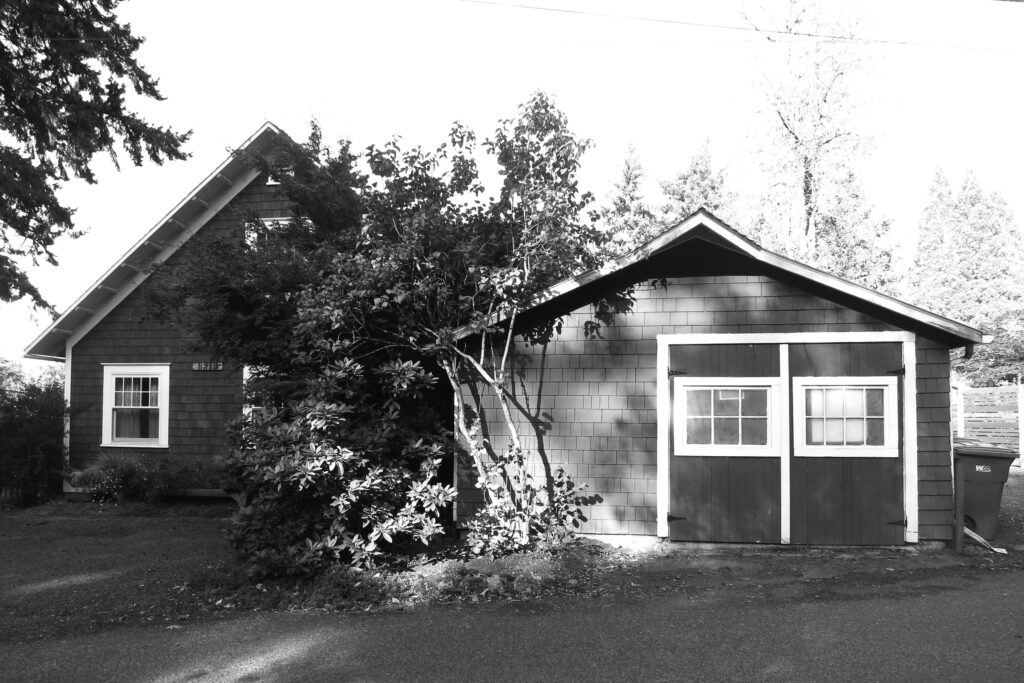 The old garage was too small for a modern car and dominated the front yard of the home.
