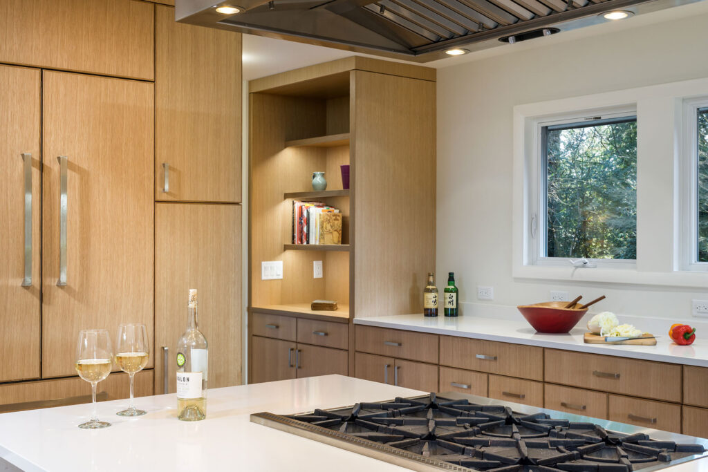 This entertainer's kitchen has built-in shelving for cookbooks.