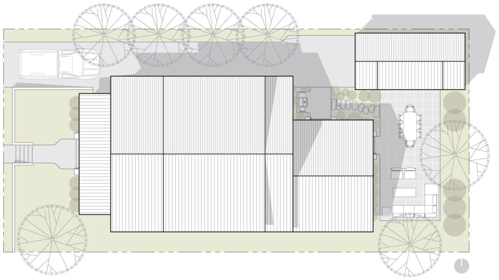 Architectural site plan drawing showing the detached garage in the northeast corner of the site.
