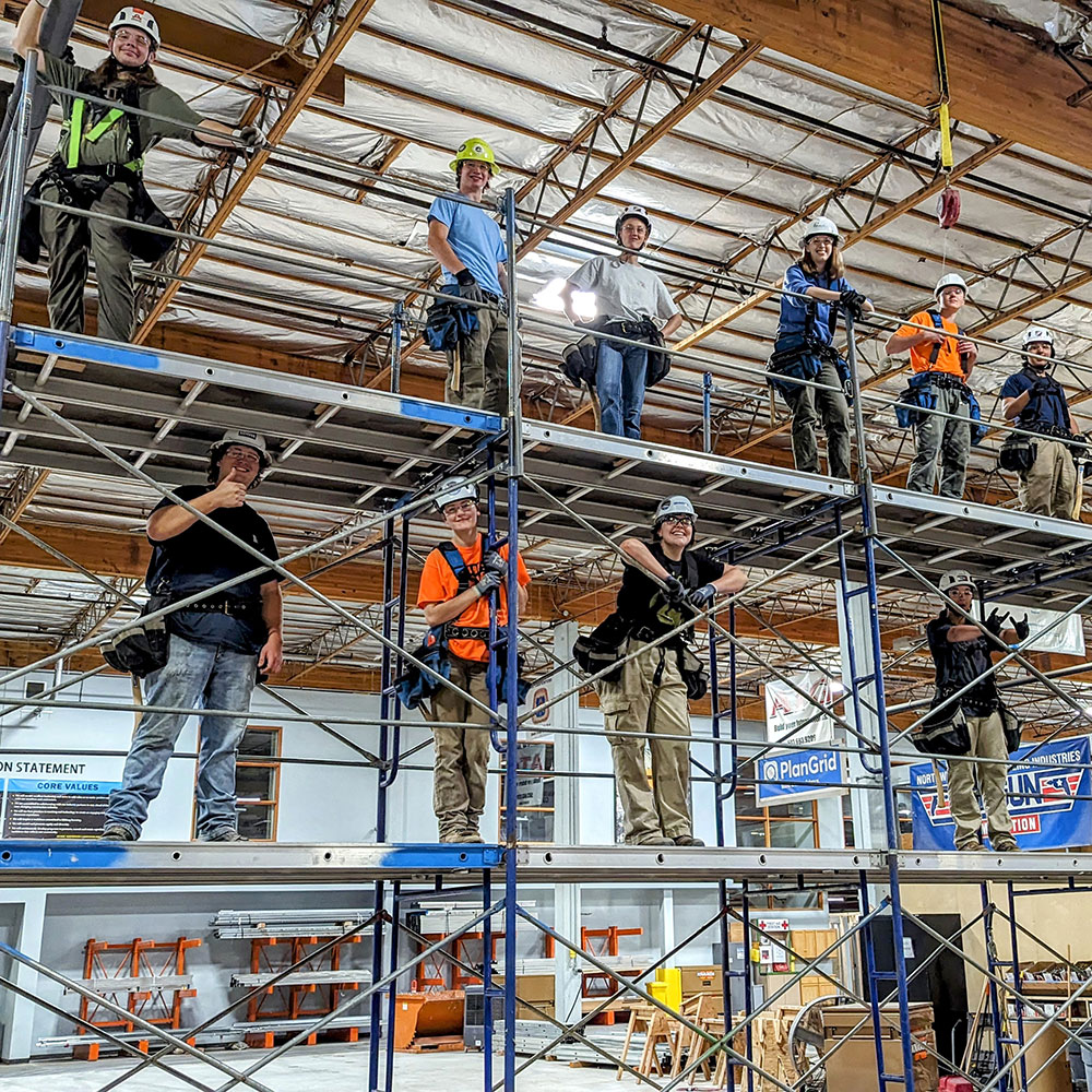 Students gather on scaffolding at PNCI.