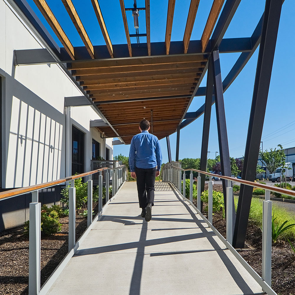 Commercial building entry ramp providing an accessible path of travel, illustrating accessibility improvements related to the 25% accessibility rule.