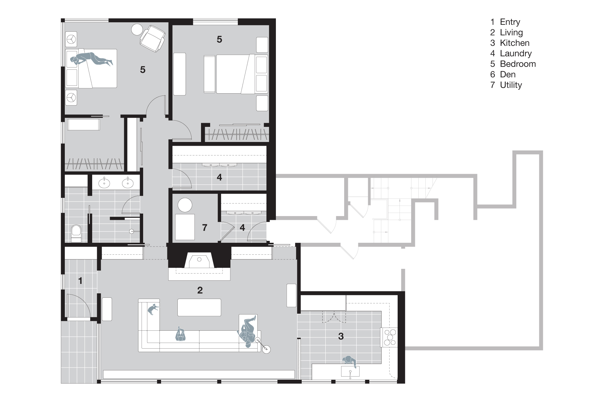 Basement floor plan after renovation showing reconfigured layout with open living area, new bedroom, bathroom, and kitchenette, along with improved circulation and connection to the stairs.